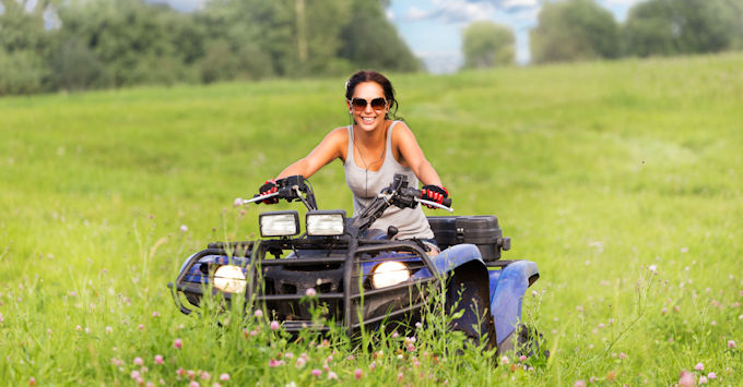 lady on atv in field