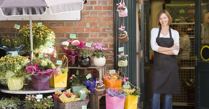 lady in front of flower shop